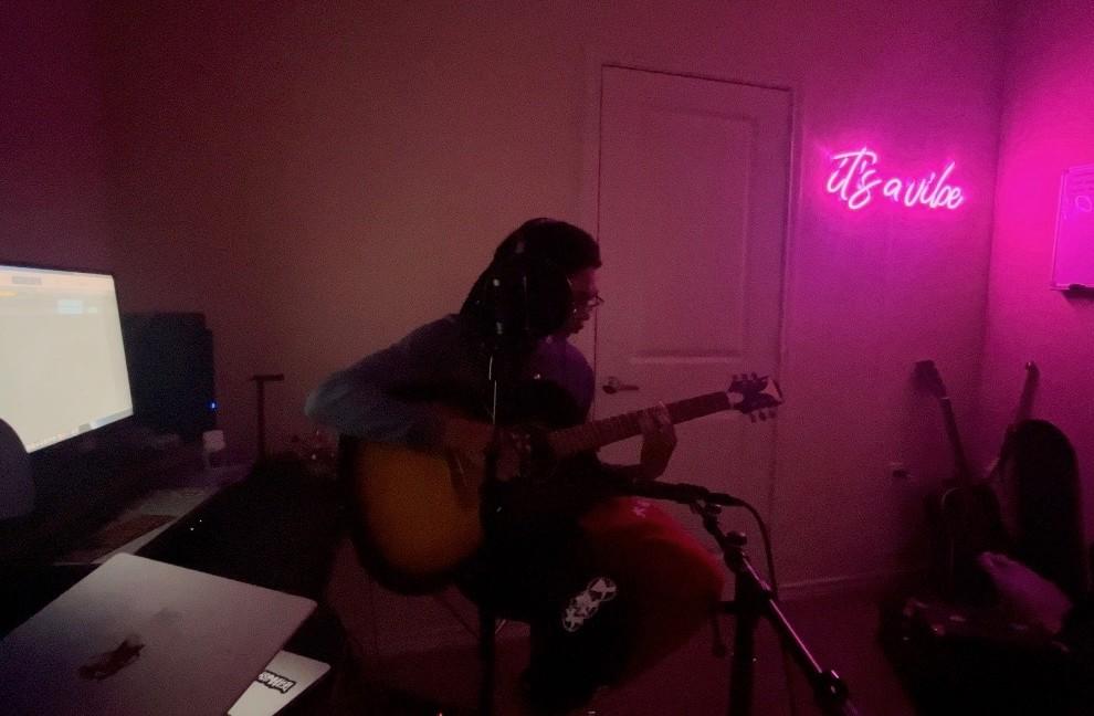 Qy Fox playing guitar